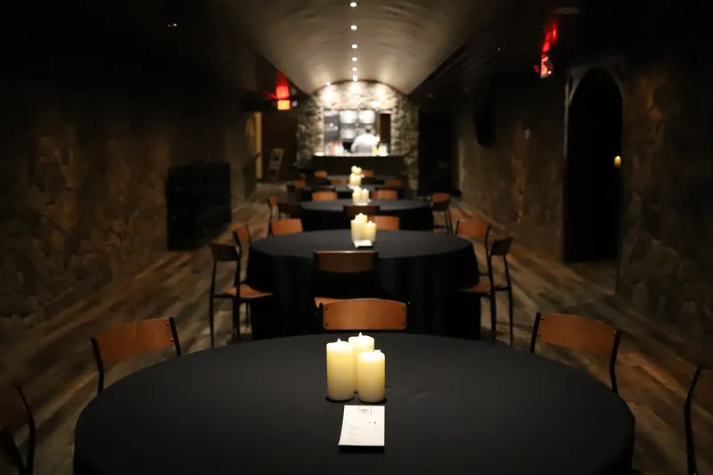 Bella Vino event room with stone archways and dining tables