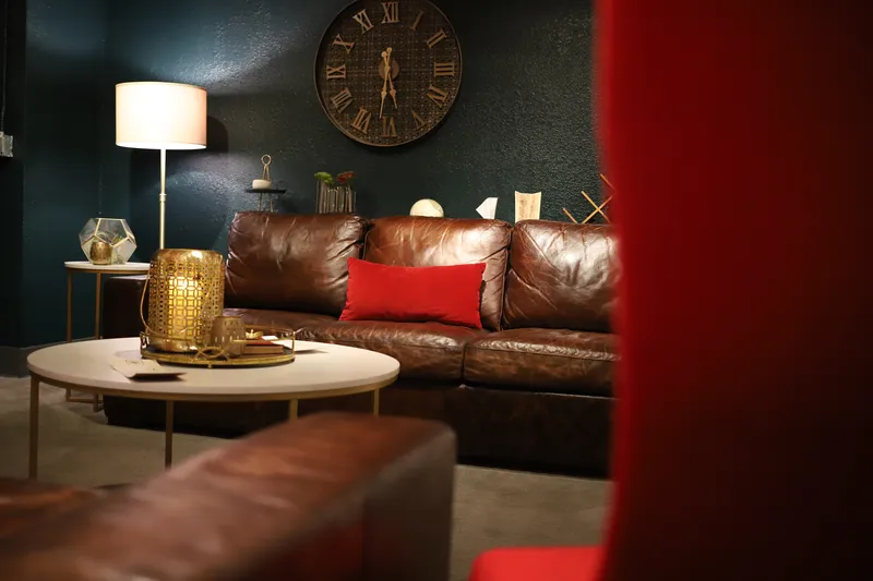 Red velvet wingback chairs in Bella Vino lounge