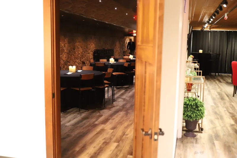 Stone archway connecting Bella Vino event room and lounge area